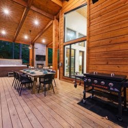 Covered deck with an outdoor dining table and a Blackstone griddle