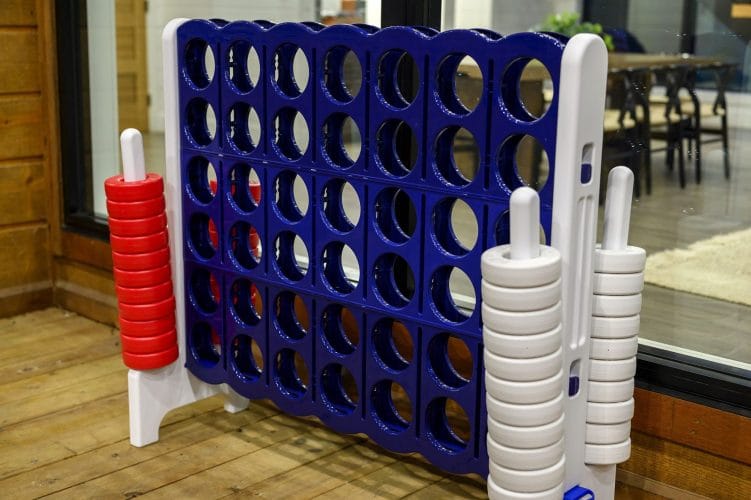 Giant Connect 4 game standing on the deck