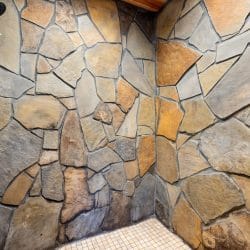 Stone-faced walk-in shower