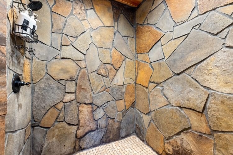 Stone-faced walk-in shower