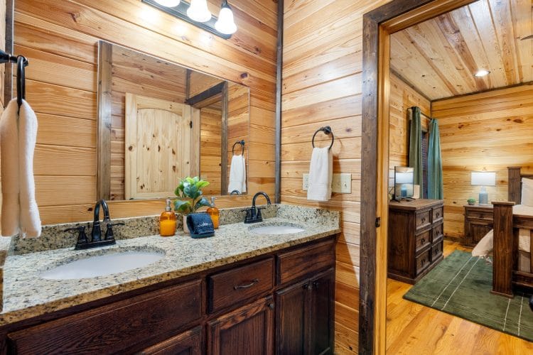 Double sink vanity with a view into the bedroom