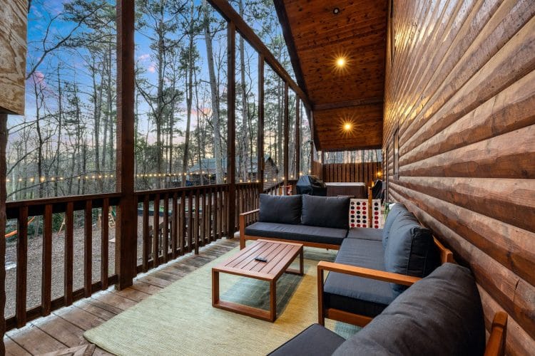 Porch seating and a giant Connect Four along the railing