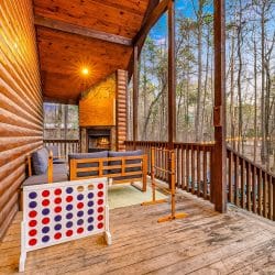 Porch with a sectional and a giant Connect Four game