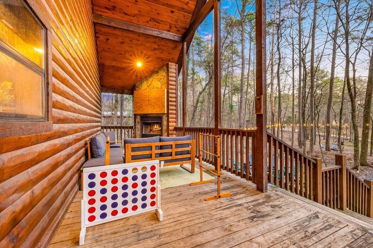 Porch with a sectional and a giant Connect Four game