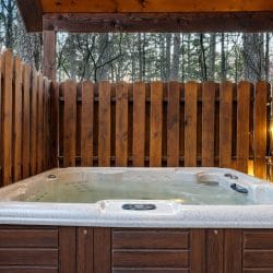 Hot tub inside a wooden privacy fence