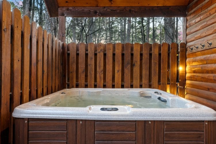 Hot tub inside a wooden privacy fence