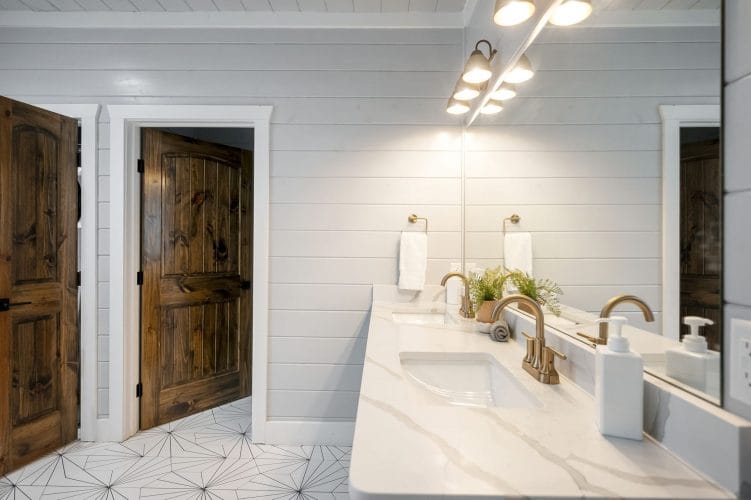 Vanity with a mirror and two wood doors