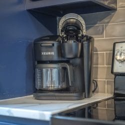 Keurig coffee maker on the counter beside the stove