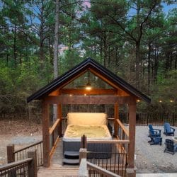 Peaked timber roof with a ceiling fan over the hot tub area