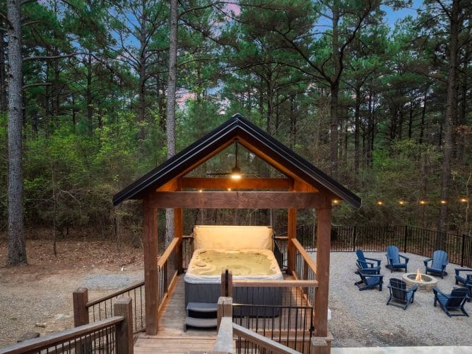 Peaked timber roof with a ceiling fan over the hot tub area