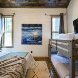 Framed wall art of an animal swimming in rushing water