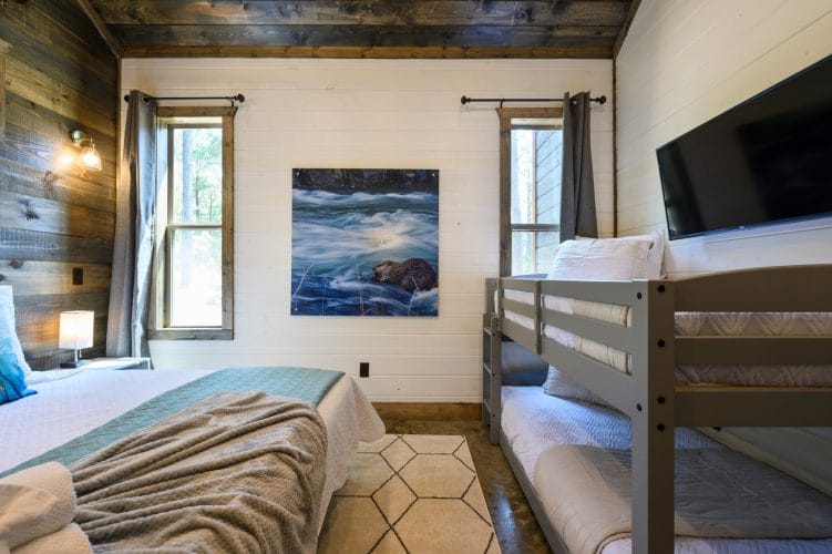 Framed wall art of an animal swimming in rushing water