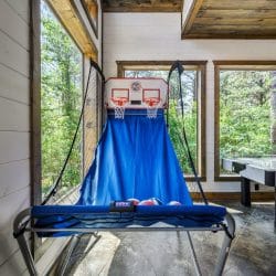Blue backboard cover with a basketball hoop net at the top