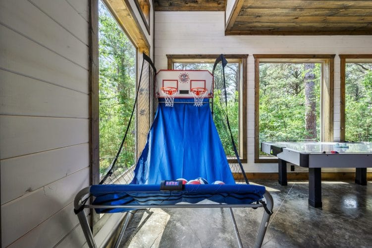 Blue backboard cover with a basketball hoop net at the top