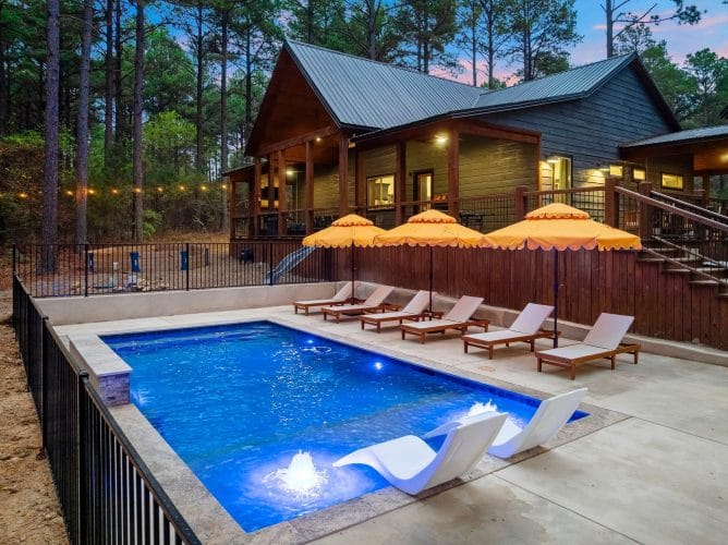 Loungers and yellow scalloped umbrellas beside the pool