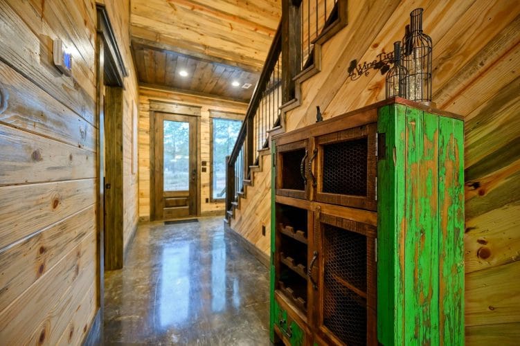 Staircase and a built-in wood cabinet with wire-mesh doors