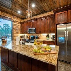 Kitchen counter with a pull-down faucet and two glasses of white wine