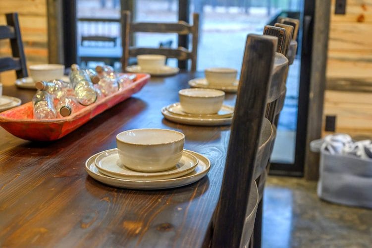 Close view of stoneware plates and bowls on a table