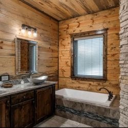 Soaking tub under a window beside a vessel-sink vanity