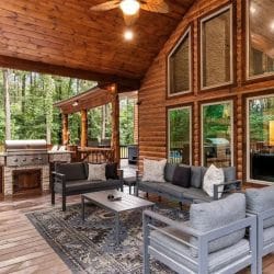 Covered deck seating and the built-in grill area under a vaulted ceiling