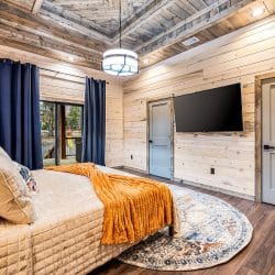 Same king bedroom with a wall TV