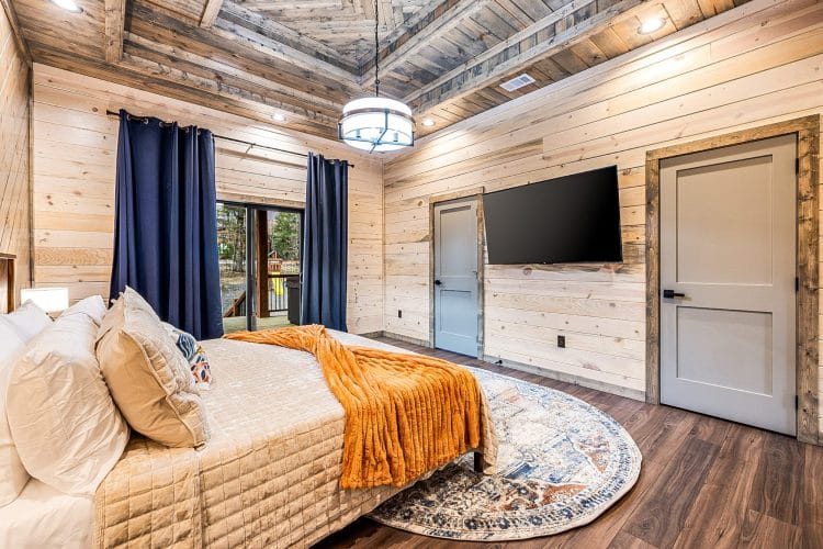 Same king bedroom with a wall TV