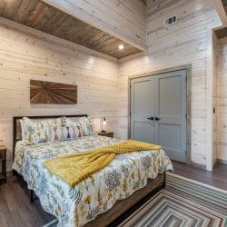 Second queen bedroom from the foot of the bed, with a closet
