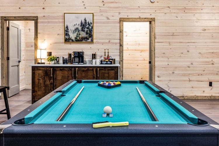Teal pool table with the coffee bar behind it