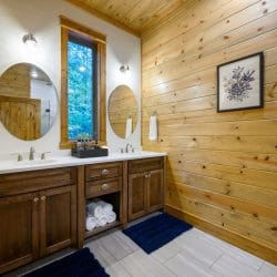 Double vanity with two round mirrors and a white counter