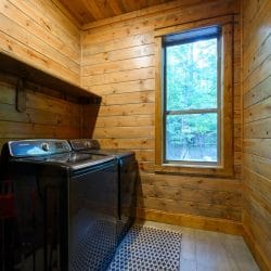 Washer and dryer in a laundry room with a window