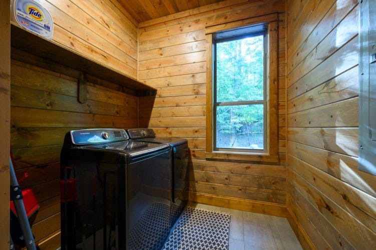 Washer and dryer in a laundry room with a window