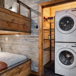 Stacked washer and dryer beside the bunk nook
