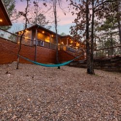 Hammock strung beneath the deck beside the retaining wall