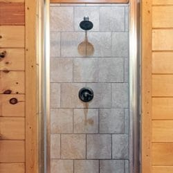 Tile walk-in shower with a rain-style head