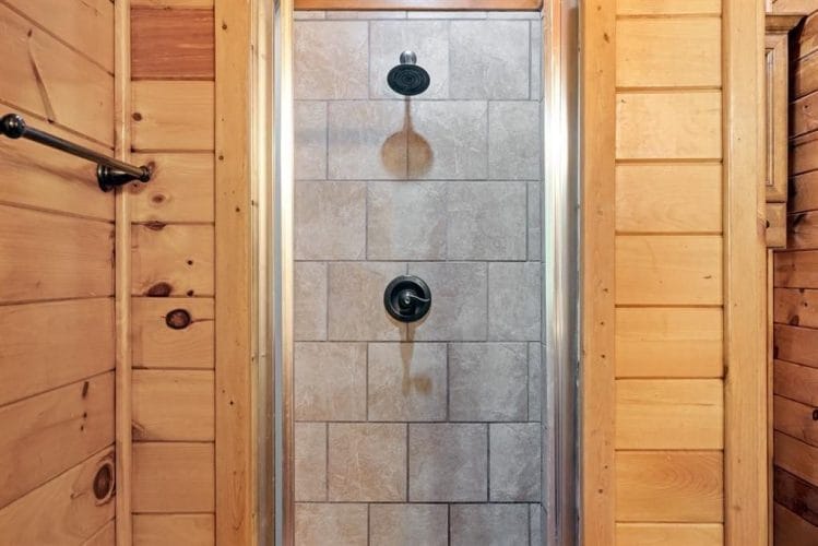 Tile walk-in shower with a rain-style head