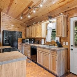 Kitchen counters and cabinets leading to the back door
