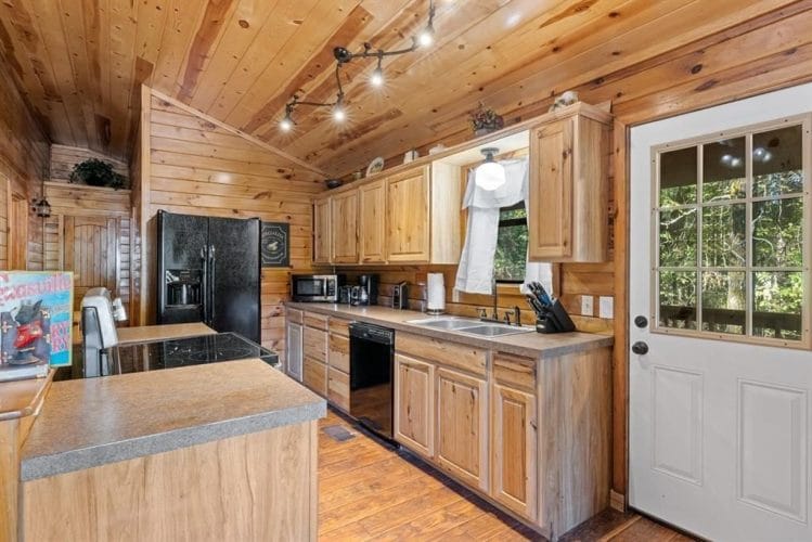 Kitchen counters and cabinets leading to the back door