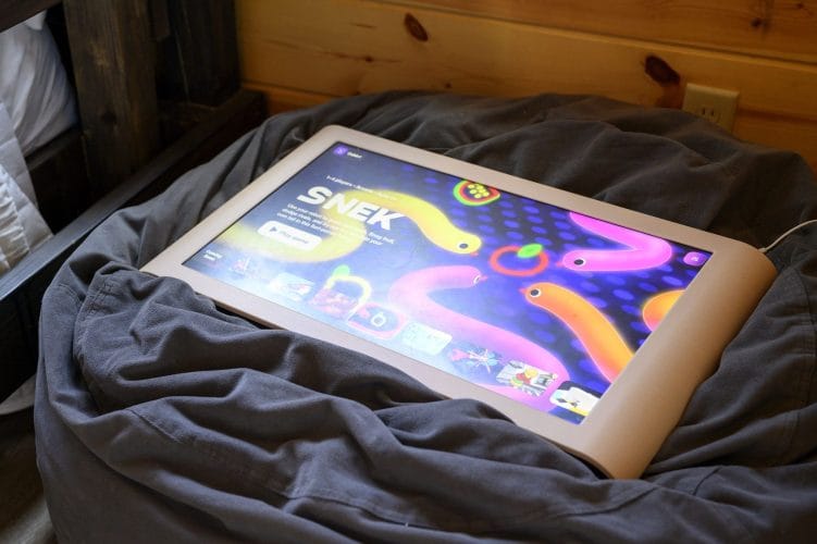 Close view of a game tablet on a gray beanbag