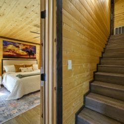 Wood stairs seen from a bedroom doorway