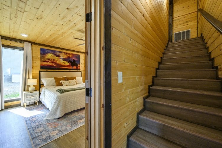 Wood stairs seen from a bedroom doorway