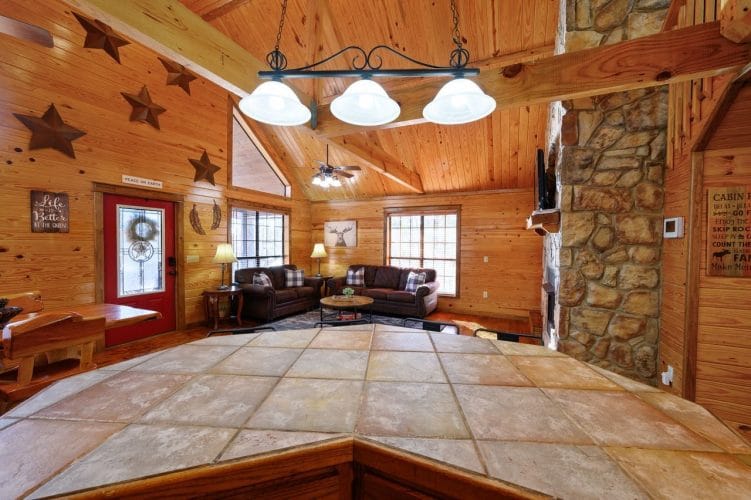 Island counter looking toward the living room and the stone fireplace