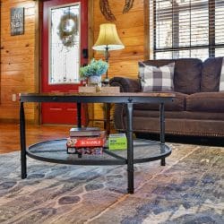 Sofa and a glass coffee table with board games beside the red front door