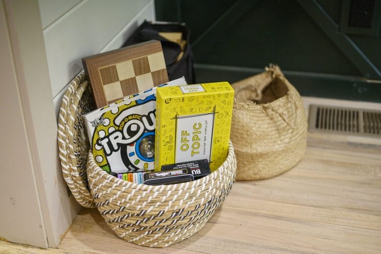 Basket of board games and a checkerboard