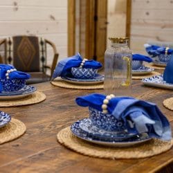 Close view of blue place settings on the dining table