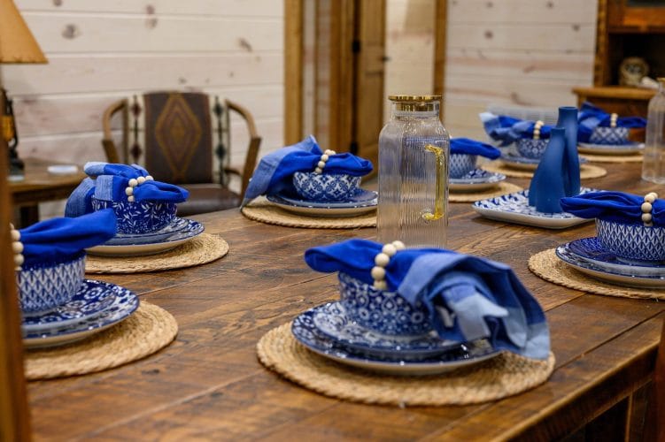 Close view of blue place settings on the dining table