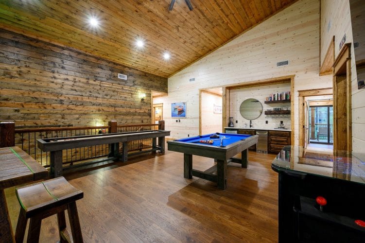 Shuffleboard, a blue-felt pool table and the bar nook in the loft