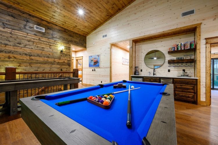 Blue-felt pool table with balls racked
