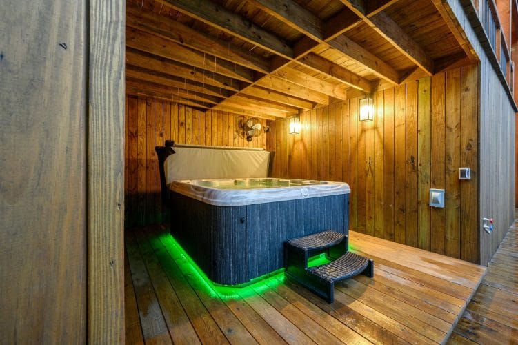 Hot tub with green underlighting on the lower deck