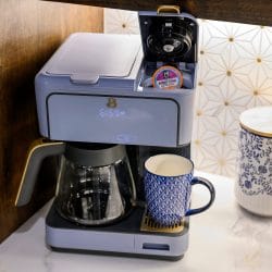 Coffee maker with a mug on the kitchen counter