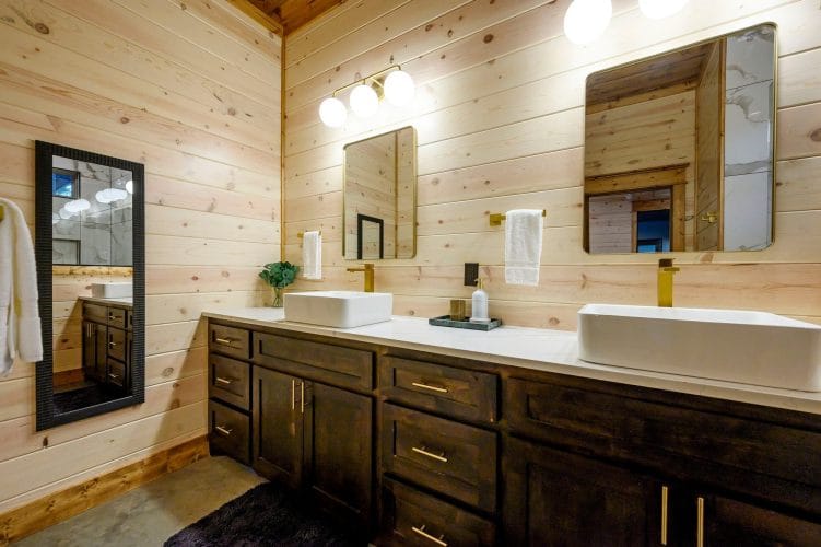 Double vessel-sink vanity with a mirror and a framed picture